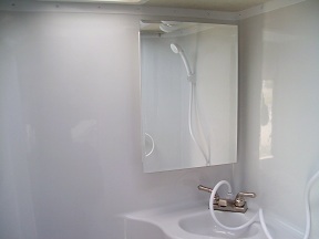 Wet bath with lavatory sink and medicine cabinet