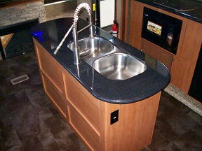 Island countertop with sink in the kitchen