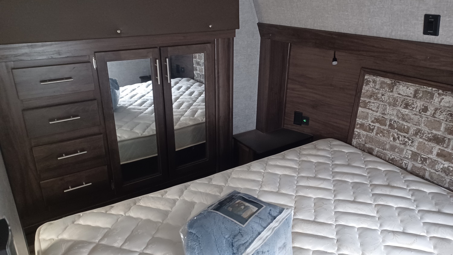 Arctic Wolf 305ML6 bedroom with lots of storage and a bed that looks like it's never been slept on