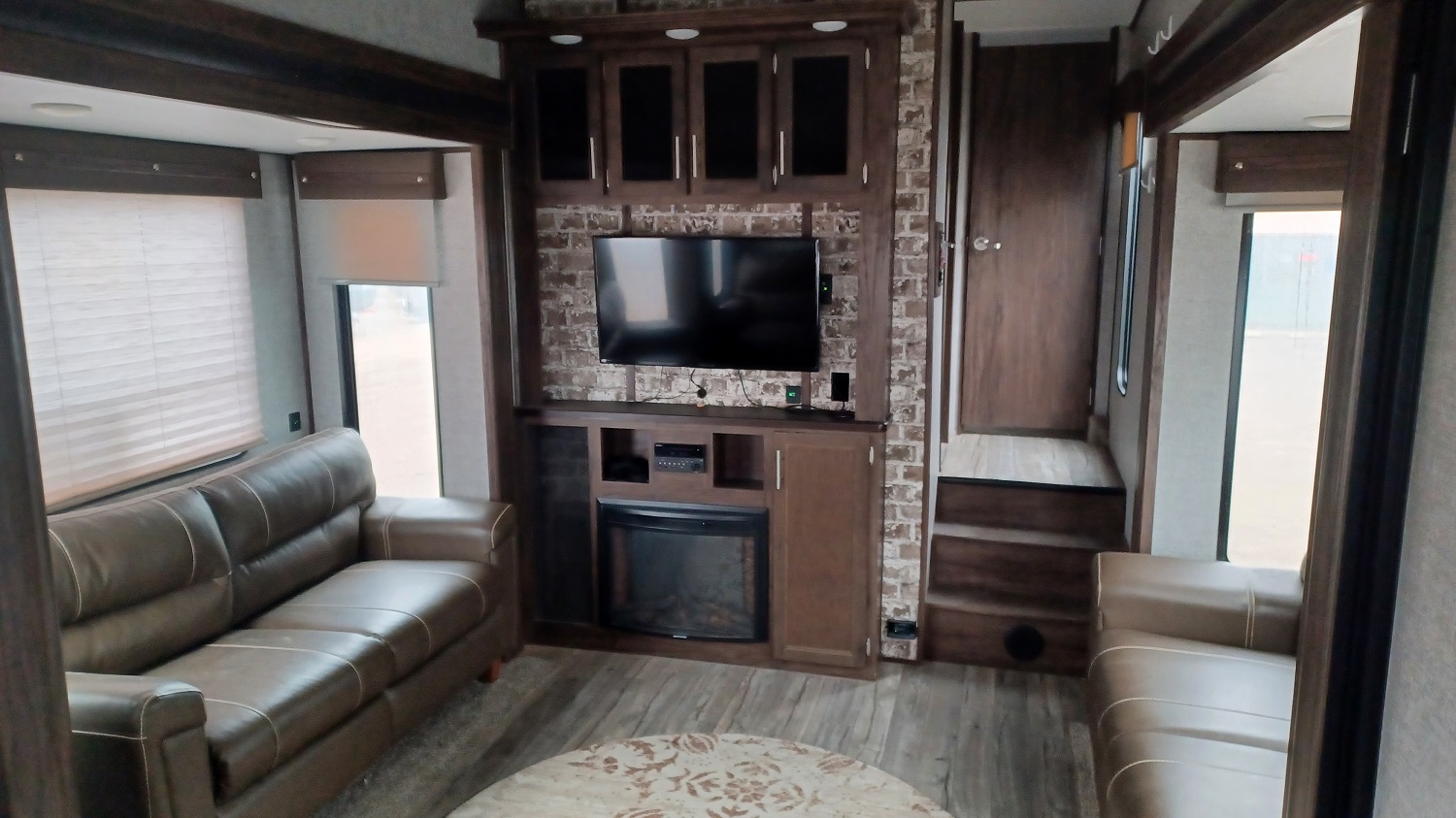 Arctic Wolf 305ML6 living room with three sofas around an entertainment center