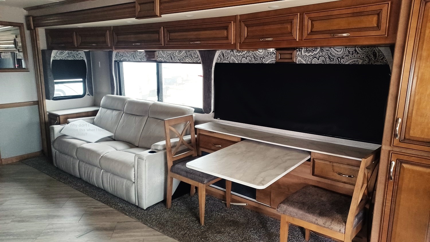 Fleetwood Bounder 35K slideout showing sofa and dinette