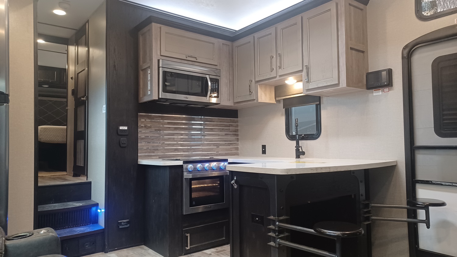 Fuzion 369 kitchen with island bar and swing out stools