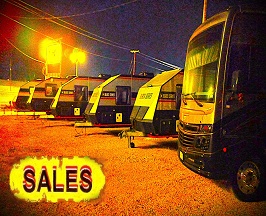 Link to SALES with a photo of the fronts of five Black Series trailers and one Fleetwood Bounder motorhome taken at night with high exposure and sturation filters applied to create the brighter than it should be effect