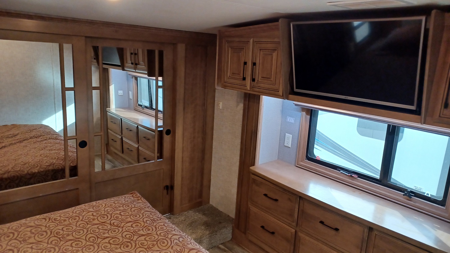 What bedroom is complete without a TV?