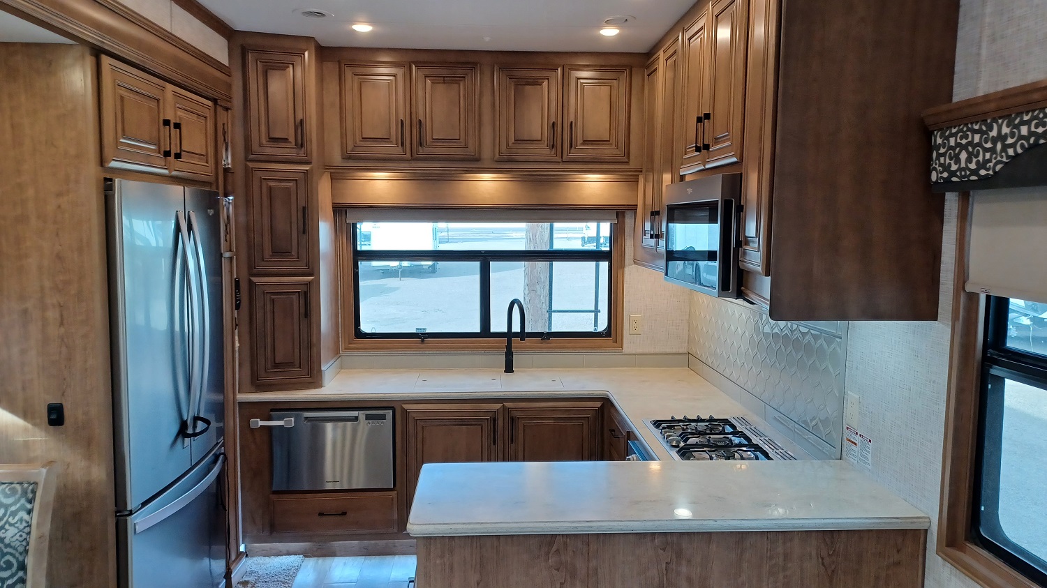 Kitchen with a large refrigerator and lots of cabinet space